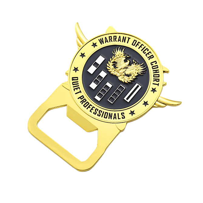 A gold metal bottle opener shaped like a badge, featuring an eagle emblem and a logo.