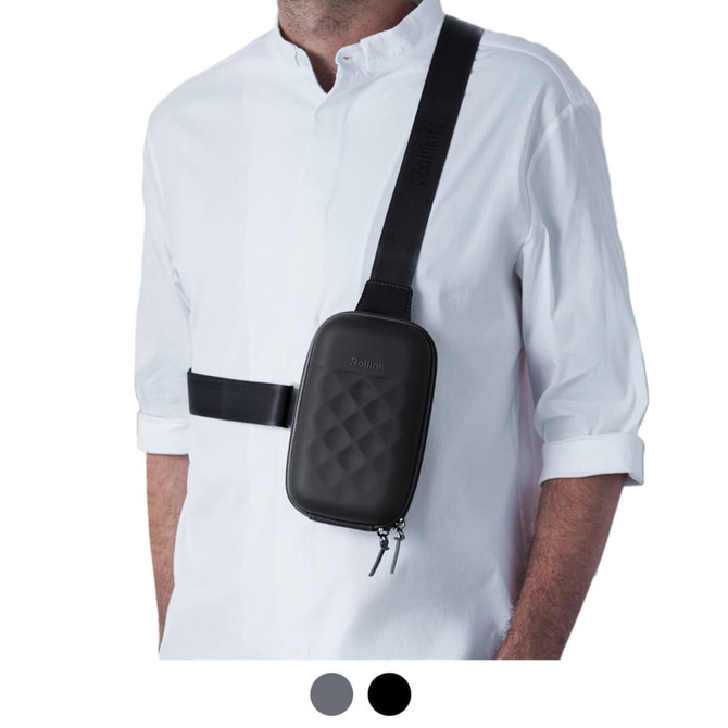 A black roll-top mini bag worn across a person’s body, featuring a quilted design and adjustable strap.