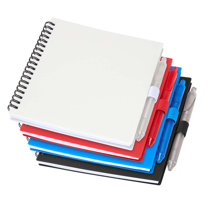 A stack of four journals in red, black, and blue, accompanied by two silver pens and featuring a logo.