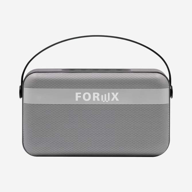 A rectangular grey wireless speaker with a black handle and a mesh front, featuring a logo on the front.