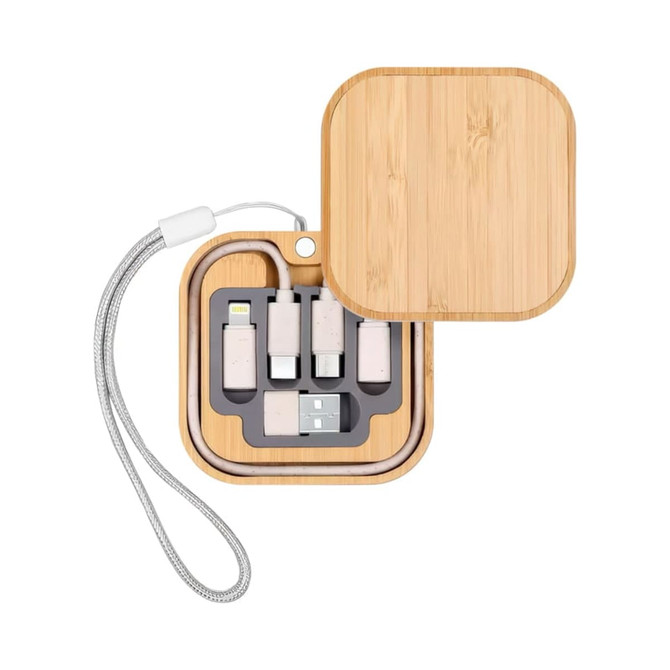 A bamboo case containing various charging cables and a wireless charger, with a silver strap.