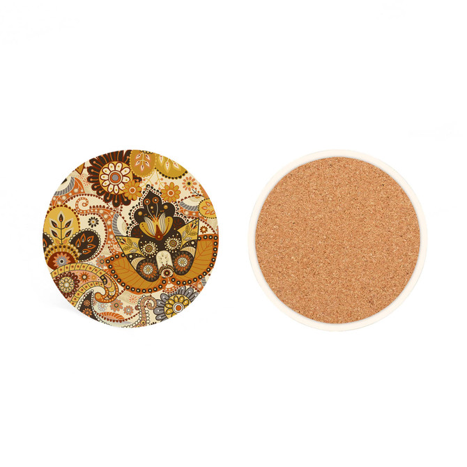 A round ceramic coaster with a colourful paisley pattern on one side and a cork base on the other.