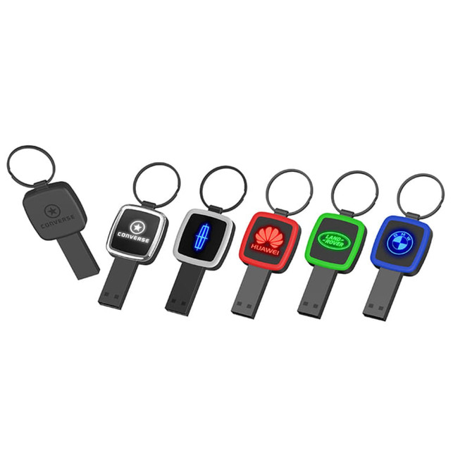 A set of six USB flash drives in various colours, each with a different logo and keychain attachment.