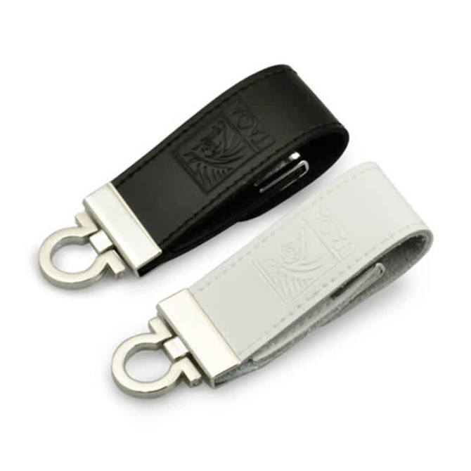 A black and a white seal leather USB flash drive with metal clips, featuring embossed designs.