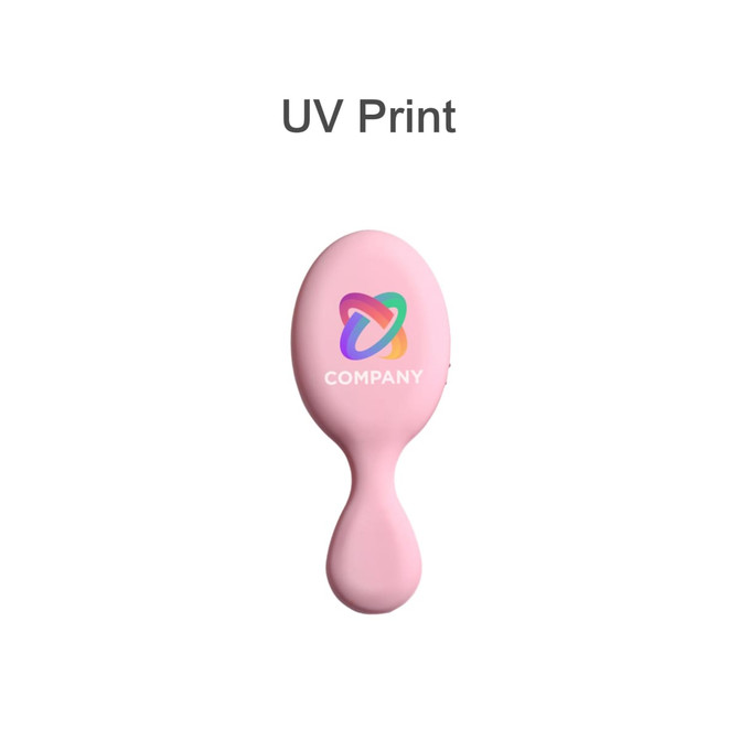 A pink mini paddle brush with a branding logo on the handle.