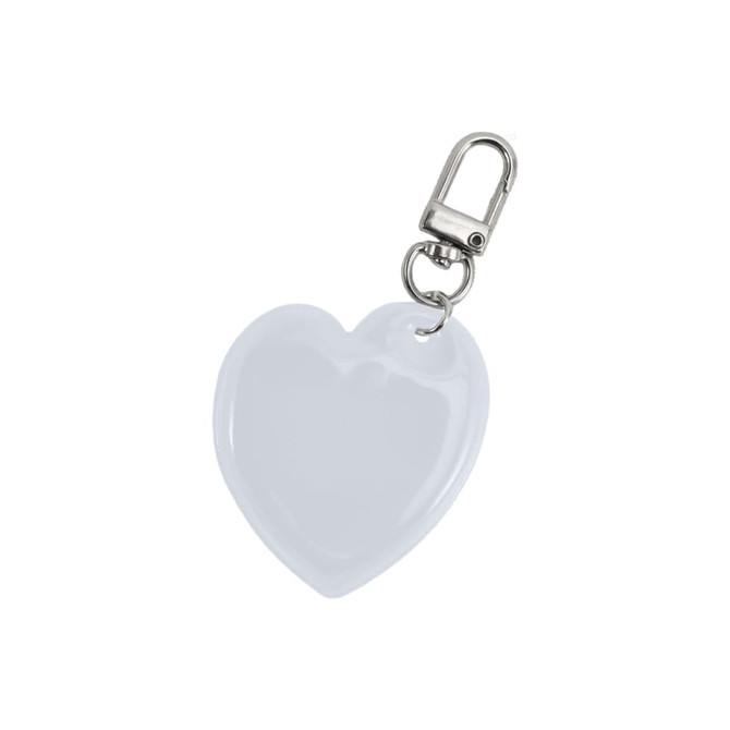 A heart-shaped reflective keychain in white with a metal clip for attachments.