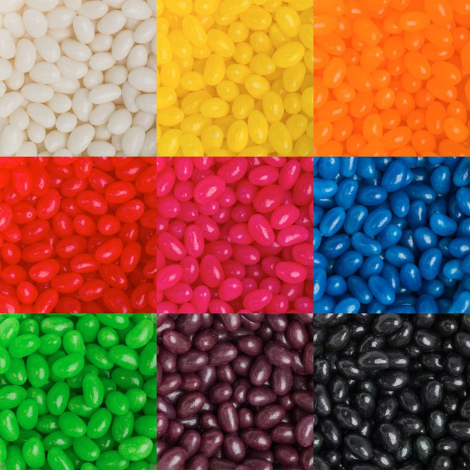 A collection of jelly beans in various colours, including white, yellow, orange, red, blue, green, pink, purple, and black.