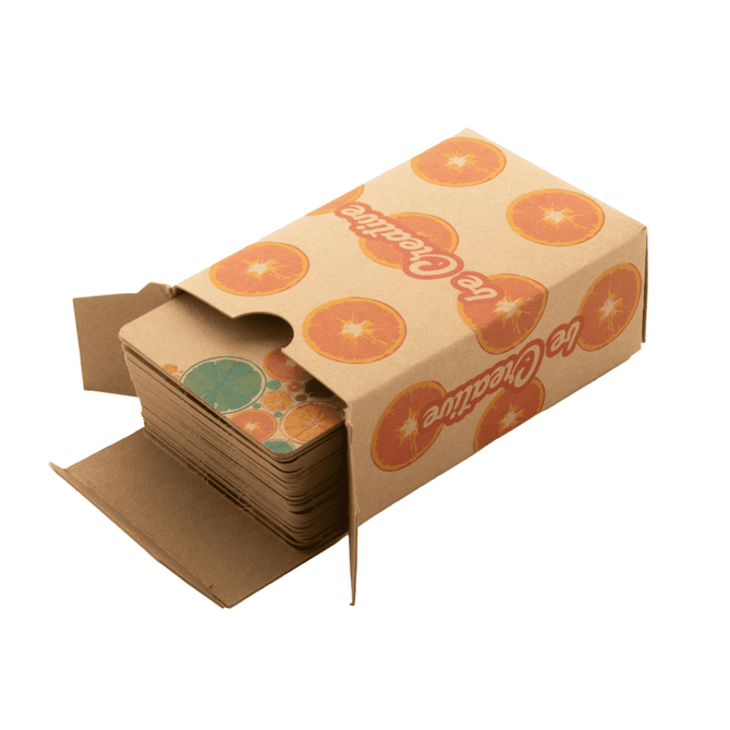 A deck of custom playing cards in a cardboard box featuring a fruit design, predominantly orange and green.