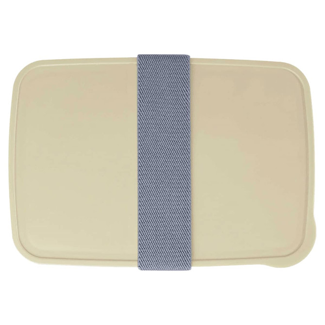 A cream-coloured lunch box with a denim-style elastic band. The design features a simple, rectangular shape and a logo.