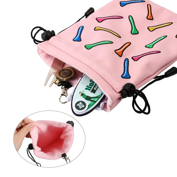 A pink pouch with a playful design, featuring various coloured golf tees, and containing assorted golf accessories.