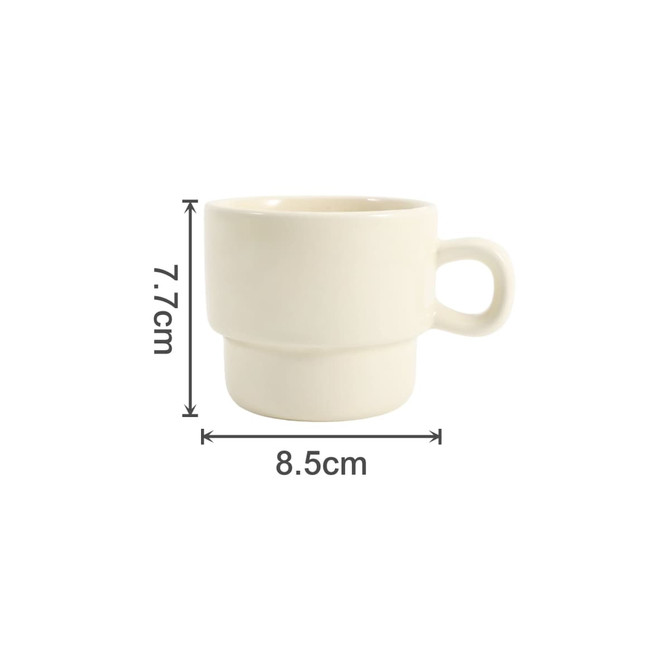 A stackable ceramic mug in off-white, featuring a single handle and marked measurements.