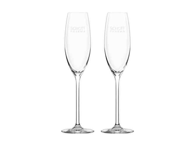 A pair of clear glass flute champagne glasses with slender stems and an etched logo.