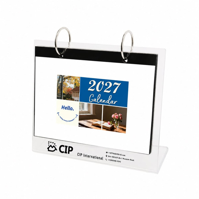 A desk calendar and photo album organiser with a clear plastic design and silver rings, featuring a 2027 calendar.
