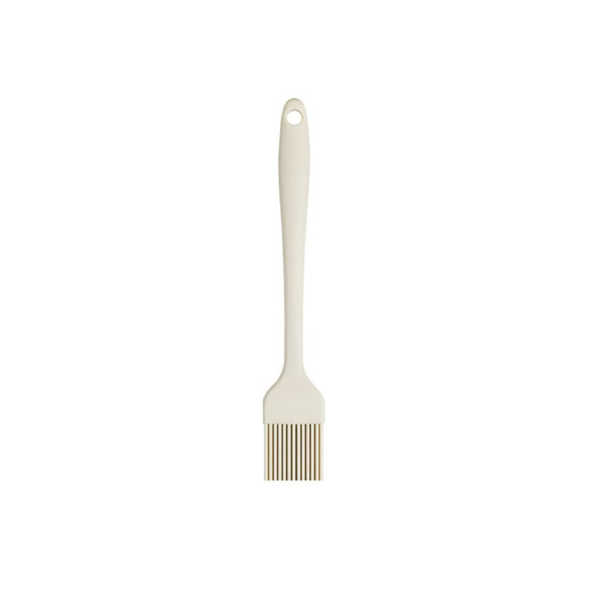 A silicone basting brush in cream, featuring a long handle and a brush head with flexible bristles.