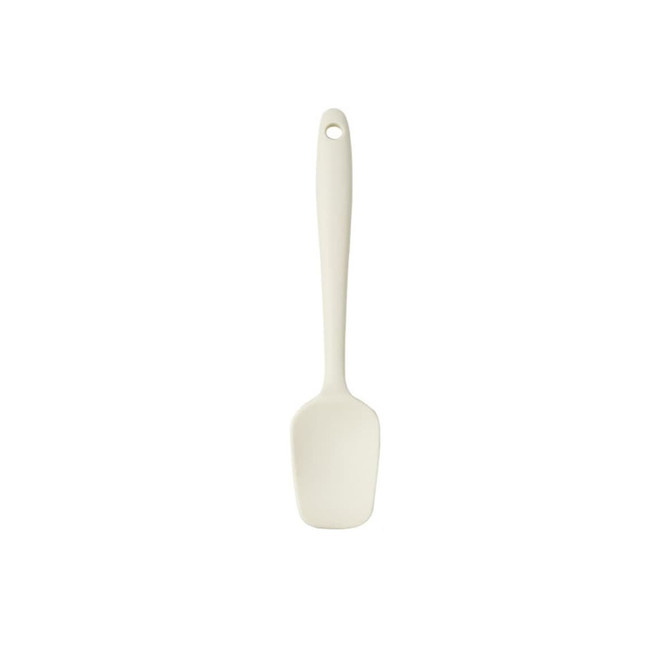 A silicone spatula in a light cream colour with a long handle and a rounded head. It features a hole for hanging.