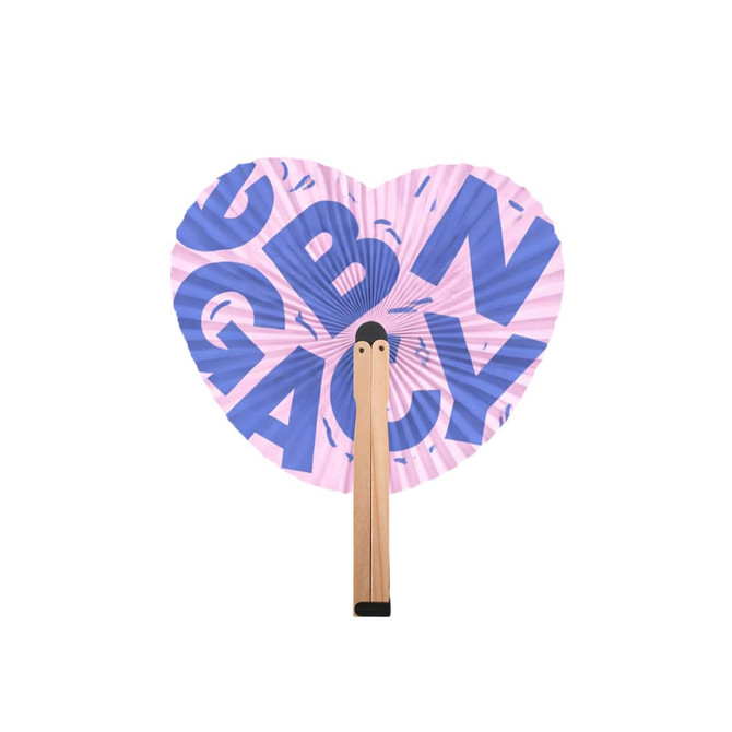 A heart-shaped wooden paper fan features a pink design with bold blue letters and a wooden handle.