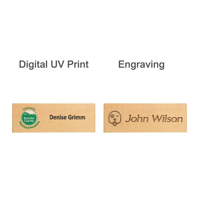 Wooden name badges featuring a green logo, one with digital UV print and another with engraving. Finished in natural wood.