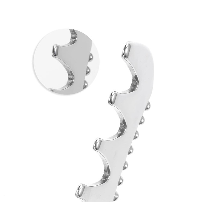 A stainless steel 2 in 1 scraping board with a curved edge and textured grip, featuring a circular mirror inset.