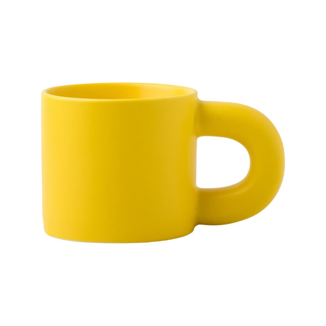A yellow ceramic coffee mug with a distinctive handle, featuring a smooth matte finish and no patterns or designs.