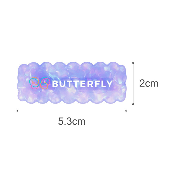 A wavy rectangle iridescent hair clip in purple and white, featuring a logo, measuring 5.3 cm by 2 cm.