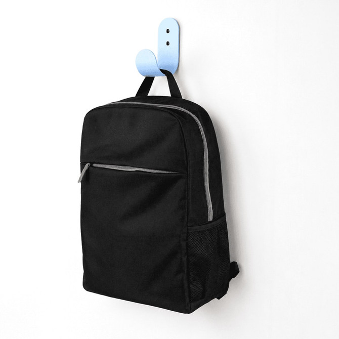 A black urban sports backpack with a front zip pocket and mesh side pocket, hanging on a blue hook.
