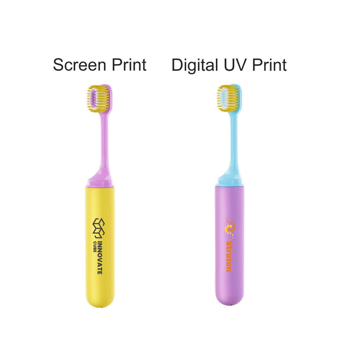 A foldable soft bristle toothbrush in yellow and purple, featuring a logo on the yellow part.