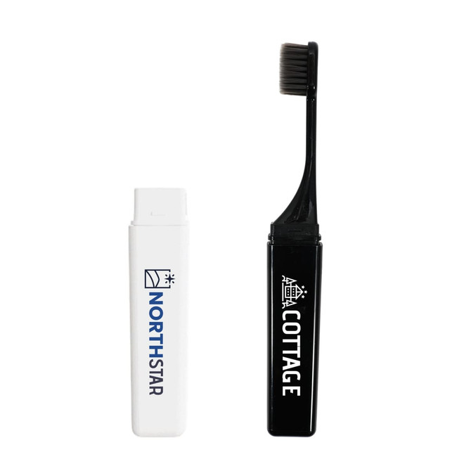 A foldable travel toothbrush in black, stored in a compact white case with a logo.