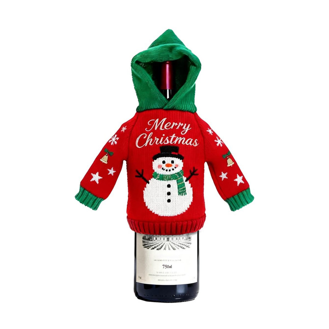 A drink bottle covered with a red and green knitted wine bottle cover featuring a snowman design.