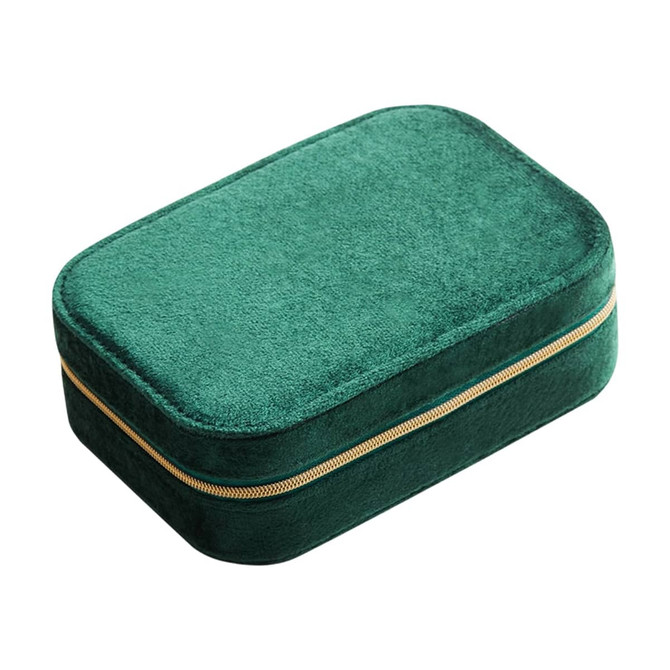 A green velvet jewellery box with a compartment and gold zipper detailing. Features a soft textured surface.