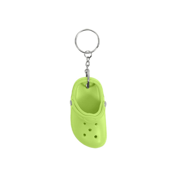 A lime green clog shoe keyring with a metal keyring attachment. The keyring features a small croc-style shoe design.
