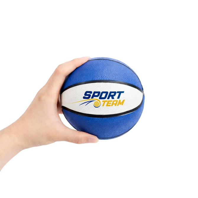 A blue mini basketball held in a hand, featuring a white stripe and a logo.