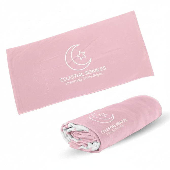 A pink beach towel featuring a logo, presented flat and rolled.