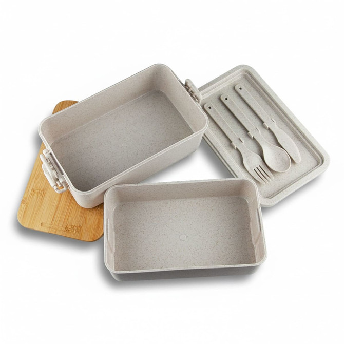 A stackable bamboo lunch box in beige, featuring two containers and a wooden lid, with utensils included.