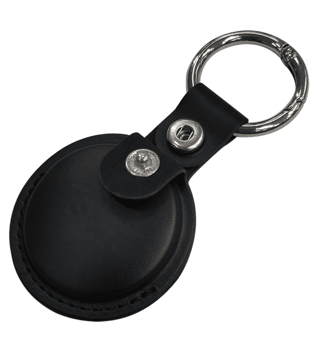 A black tracking tag with a keyring attached, featuring a leather case and metal snap.
