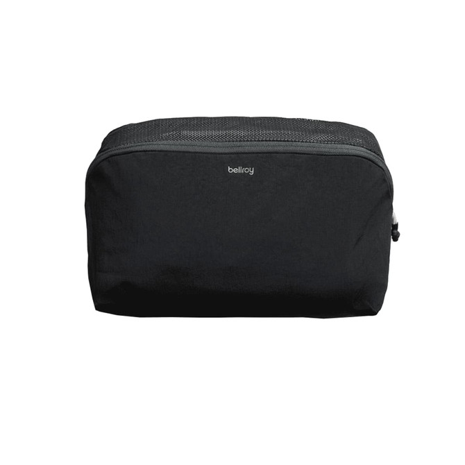 A black packing cube with a mesh top and a logo, designed for organising travel essentials.