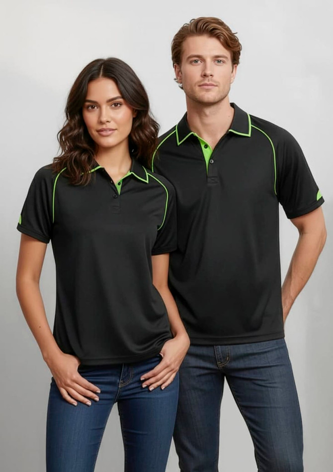 A black polo shirt with green accents, featuring a collar and short sleeves, modelled by two people.