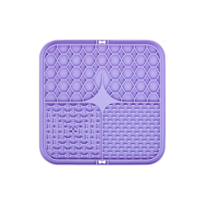 A purple 3-section dog enrichment lick mat featuring various textured areas including honeycomb and bone patterns.
