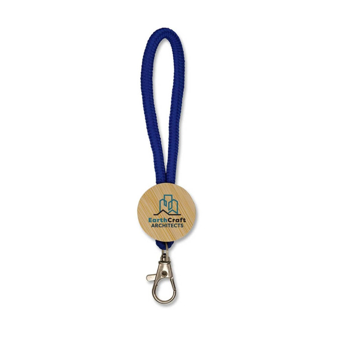A blue keytag with a wooden circular pendant featuring a logo, attached to a metal clasp.