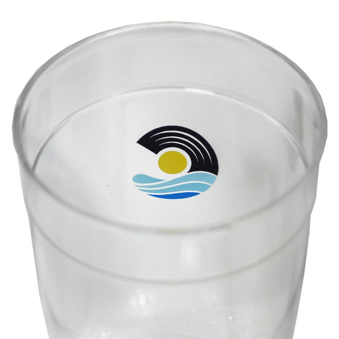 A clear Tritan carry cup featuring a circular logo with waves and sun design. Ideal for drinkware use.