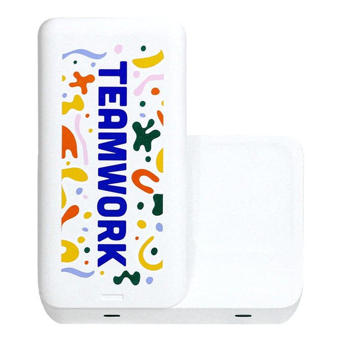A white wireless charger with colourful abstract designs and the word "TEAMWORK" prominently displayed.