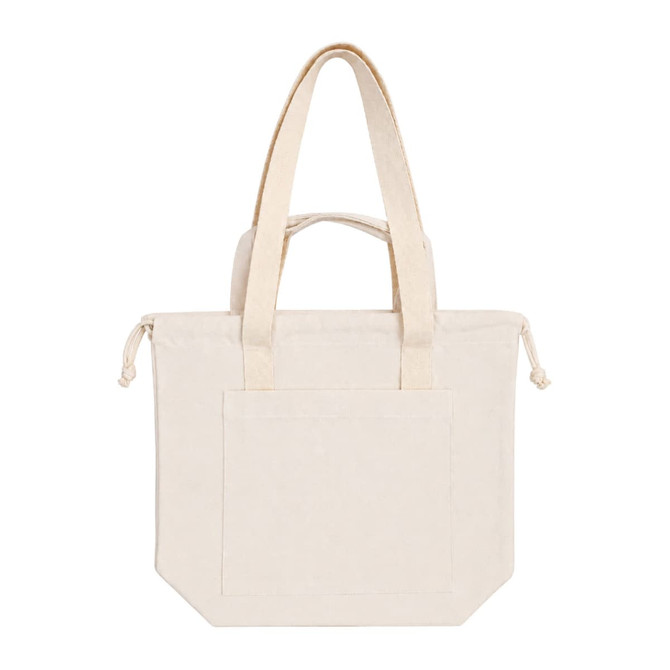 A cream tote bag with double handles and a front pocket, featuring a simple design and a logo on the side.