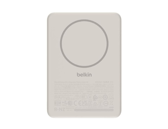 A slim, light grey magnetic power bank with a circular charging area and branding.
