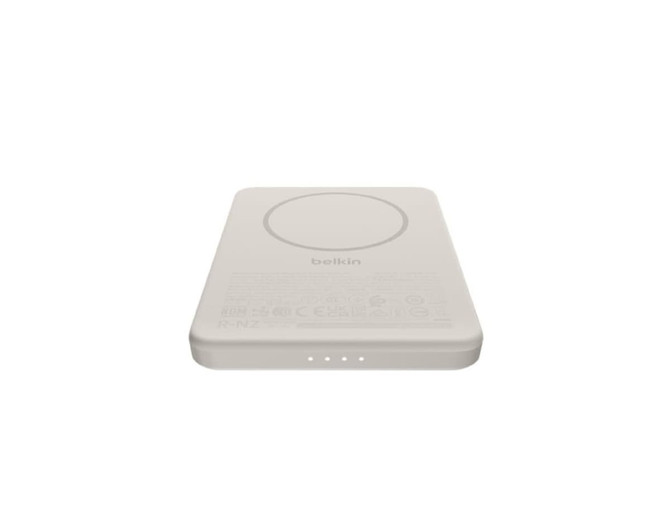 A slim, rectangular power bank in light grey with a circular magnetic area and indicator lights. It features branding.