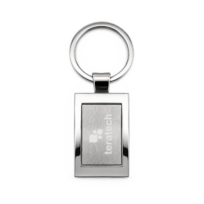 A silver keytag with a rectangular frame and a circular keyring, featuring a branded logo.