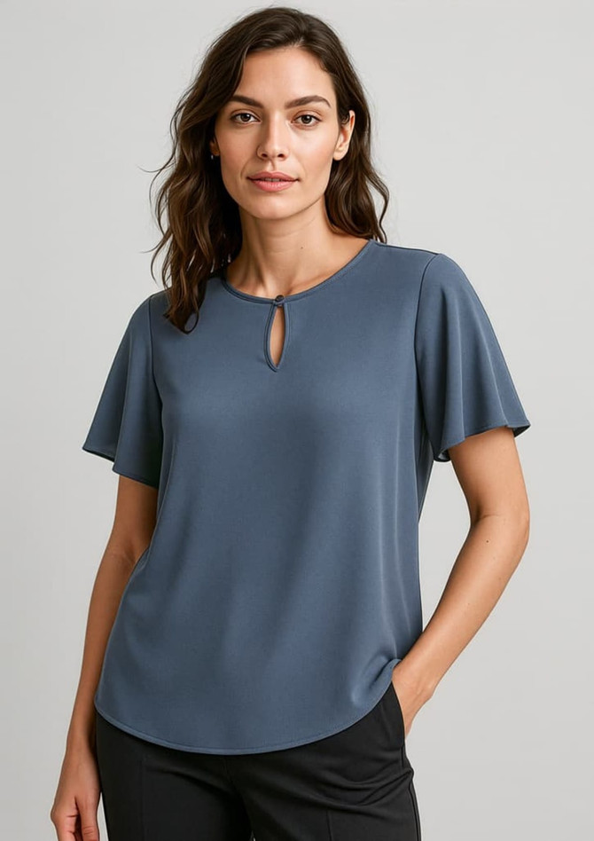 A women's short sleeve blouse in a soft blue, featuring a keyhole detail at the neckline and a relaxed fit.