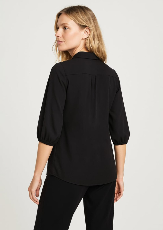 A black women's blouse with 3/4 puff sleeves, featuring a back yoke detail and a subtle logo.