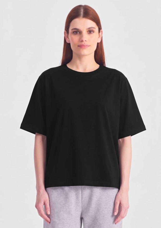 A black box tee shirt with short sleeves displayed on a model against a plain background.