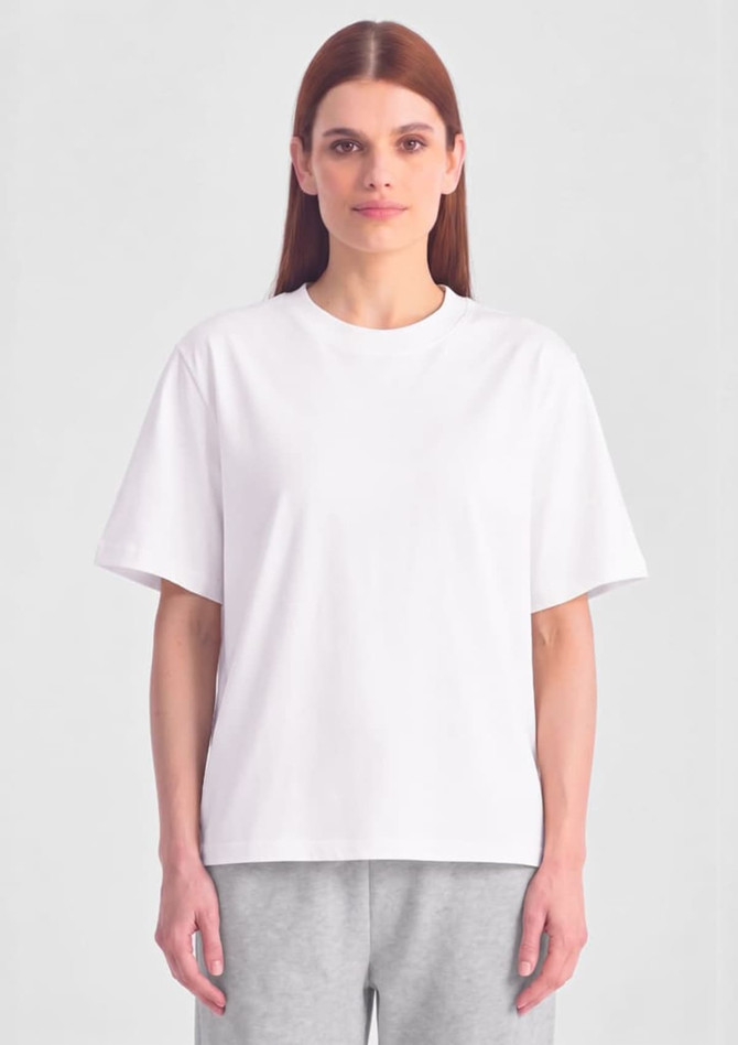 A white box tee featuring a relaxed fit, displayed on a model against a plain background.