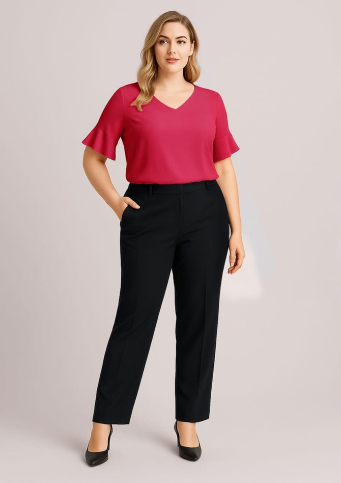 A model wearing a pink top and black adjustable waist pants, styled with a relaxed fit. The outfit features a logo.