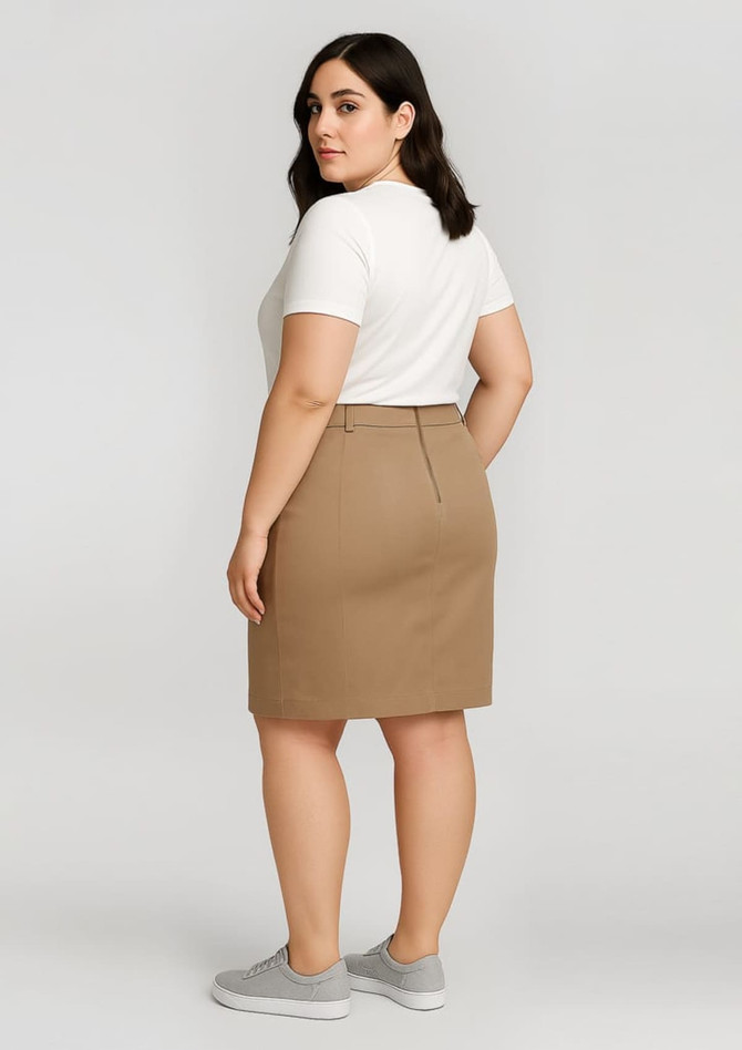 A mid-waist stretch chino skirt in khaki, featuring a fitted silhouette and a rear vent, displayed on a model.
